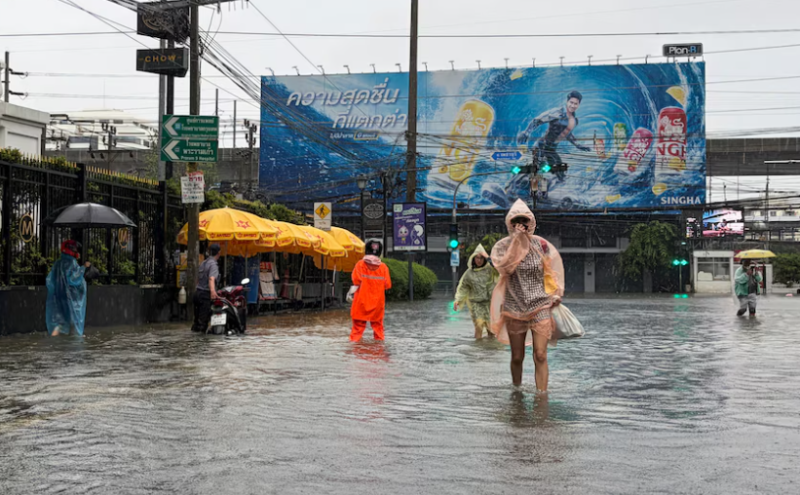 Heavy rain floods Bangkok homes and roads as city declared disaster zone