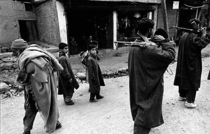 1989: Armed gangs of Kashmiri separatists patrolling a street of a town in J&K. Rising violence in the valley saw the exodus of hundreds of Hindu families from the area.   