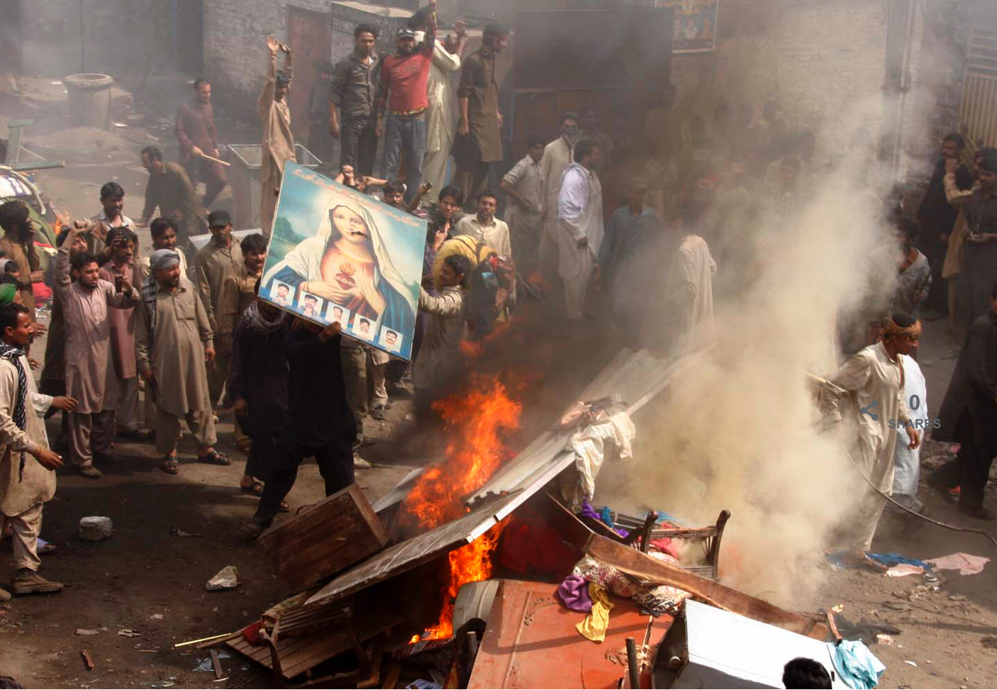 A mob of fanatics burn down a church in Pakistan. 